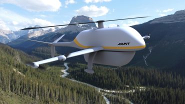Airo cargo drone flying over rural delivery route, showcasing vertical takeoff and fixed-wing cruise capabilities for middle-mile logistics.