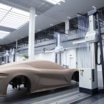 BYD electric vehicles on a global showroom floor, highlighting rapid sales growth and Tesla rivalry in 2025.