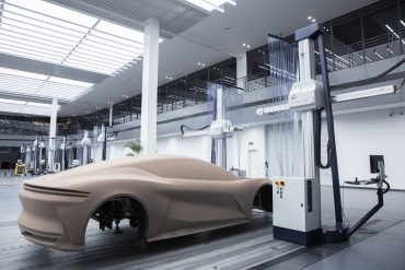 BYD electric vehicles on a global showroom floor, highlighting rapid sales growth and Tesla rivalry in 2025.