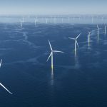 Offshore wind turbines at sea under clear skies, symbolizing Orsted’s renewable energy expansion and stock rally.