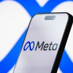 CHONGQING, CHINA - APRIL 26: In this photo illustration, the logo of Meta Platforms, Inc. is displayed on a smartphone screen, with the company's infinity loop-style branding visible in the background, on April 26, 2025, in Chongqing, China. Meta is the parent company of Facebook, Instagram, WhatsApp, and Threads, and is focused on building technologies for social connection, digital advertising, and the development of the metaverse. (