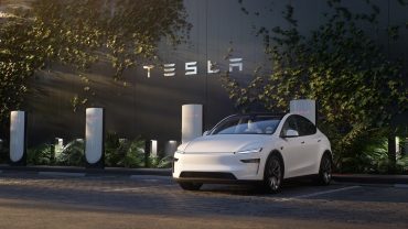 Tesla HQ building with brand name in metallic letters, symbolizing corporate resilience and Q2 financial results