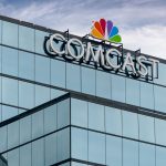 Comcast streaming and mobile revenue surge shown on screen with Q2 financial data overlay and digital devices
