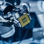 Modern High Tech Authentic Robot Arm Holding Contemporary Super Computer Processor. Industrial Robotic Manipulator End Effector Holding CPU Chip
