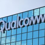 Qualcomm headquarters in San Diego with digital automotive and IoT icons overlayed, symbolizing the company’s diversification strategy