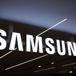 Samsung logo on building with Tesla chip overlay, symbolizing $16.5B semiconductor deal and global foundry rivalry with TSMC