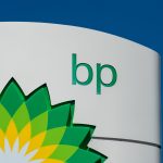 BP and Libya NOC logos over Sarir oilfield backdrop, symbolizing strategic re-entry into North Africa’s energy sector.