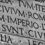 Aeneas AI interface analyzing ancient Roman Latin inscription carved in stone / Latin ancient language and classical education. Inscription from Emperor Augustus famous Res Gestae (1st century AD), with the word Imperio in the center (Black and White)