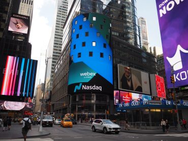 Digital display board showing Nasdaq logo and crypto icons like Bitcoin and Ethereum, symbolizing new listing access for institutional ETPs.