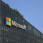 Microsoft office building with AI-themed visual overlay, symbolizing tech layoffs and transition to AI-driven operations.