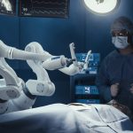 Two Surgeons Observing High-Precision Programmable Automated Robot Arms Operating Patient In Futuristic Hospital. Robotic Limbs Performing Advanced Nanosurgery, Doctors Looking At Vitals On Monitor