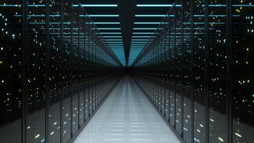Google data center with hydroelectric dam in background, symbolizing AI energy demand and clean power expansion.