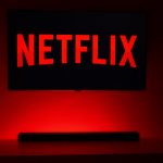 Acclaimed film director on a production set with Netflix branding, symbolizing streaming-driven creative freedom and global audience access