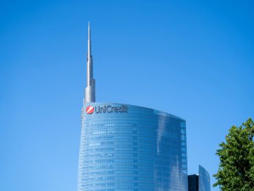 UniCredit logo at Milan HQ as bank lifts profit forecast to €10.5B and exits €14.6B Banco BPM deal