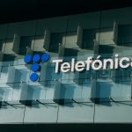 Telefónica headquarters in Spain with digital breach overlay symbolizing cybersecurity incident