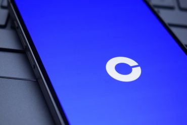 Coinbase and Perplexity logos over digital crypto trading interface, symbolizing real-time AI integration for market data insights.