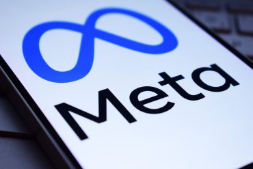 Meta logo with digital infrastructure background symbolizing AI investment
