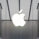 Rare earth magnet on Apple logo, symbolizing U.S. tech independence from China.