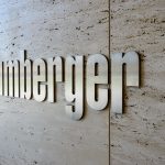 HOUSTON, UNITED STATES - FEBRUARY 2016: Schlumberger - the biggest international oilfield service company sign made of metal plates on wall on February 2016 in Houston, United States.