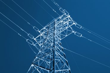 Smart power substation with AI edge devices optimizing electricity flow in real time against a digital network backdrop