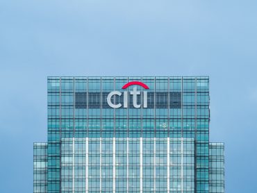 Citigroup London headquarters with financial charts overlay, symbolizing record quarterly profits and stock buyback announcement.