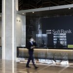 SoftBank headquarters in Tokyo with company logo, reflecting record stock rally on Vision Fund AI gains and strong quarterly profit
