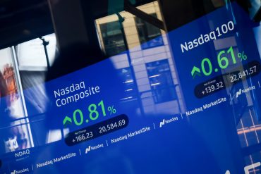 Apple and Amazon logos over Nasdaq stock chart and cloud network
