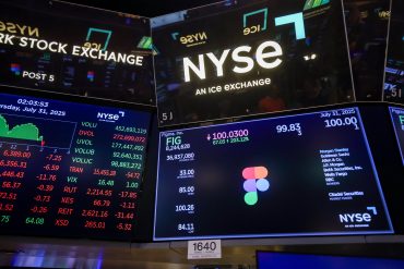 Figma Inc. signage during the company's initial public offering (IPO) on the floor of the New York Stock Exchange (NYSE) in New York, US, on Thursday, July 31, 2025. Figma Inc. shares surged as much as 229% after the design software maker and some of its shareholders raised $1.2 billion in an IPO, with the trading valuing the company far above the $20 billion mark it would have reached in a now-scrapped merger with Adobe Inc. Photographer: Michael Nagle/Bloomberg via Getty Images