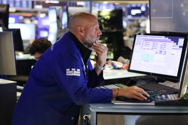 A trader works on the floor of the New York Stock Exchange (NYSE) in New York on August 15, 2025. Wall Street stocks were mixed early Friday following a solid US retail sales report as markets await a summit between the American and Russian leaders later in the day. (Photo by TIMOTHY A. CLARY / AFP)