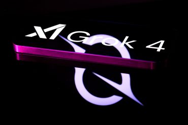 The Grok 4 Xai logo is displayed on a mobile phone in this photo illustration in Brussels, Belgium, on August 16, 2025. (Photo by Jonathan Raa/NurPhoto via Getty Images)