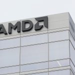 AMD logo with futuristic AI chip and data center servers in background