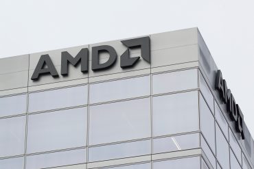 AMD logo with futuristic AI chip and data center servers in background