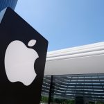 Close up of Apple store logo is shown in front of the newest Apple store at TRX Exchange shopping mall, KL. Apple signboard with a futuristic building behind