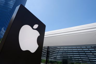 Close up of Apple store logo is shown in front of the newest Apple store at TRX Exchange shopping mall, KL. Apple signboard with a futuristic building behind