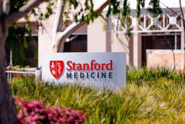 Palo Alto, California US - March 25, 2025: Stanford Medicine sign in front of its office building in Palo Alto, SF Bay Area, Silicon Valley / bluestork / Shutterstock.com