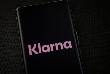 Klarna logo with data graphics illustrating BNPL growth and AI automation