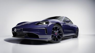 Luxury Porsche SUV in production line, symbolizing shift back to combustion and hybrid models