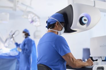 Robotic-assisted surgical system in operation, highlighting AI integration in clinical practice.