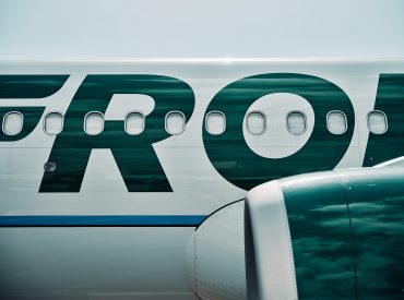 Frontier Airlines planes taxi at Denver International Airport in Denver, Colorado