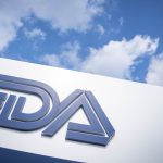 FDA headquarters building with U.S. flag at entrance