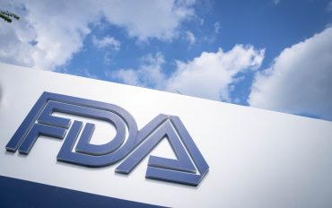 FDA headquarters building with U.S. flag at entrance