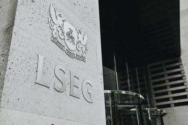 London Stock Exchange headquarters in the City of London, representing blockchain innovation in finance.