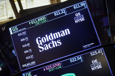 oldman Sachs Group Inc. signage on the floor at the New York Stock Exchange (NYSE) in New York
