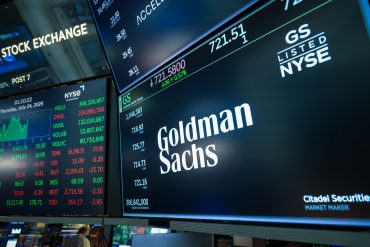 Goldman Sachs Group signage on the floor of the New York Stock Exchange (NYSE) in New York, US, on Thursday, July 24, 2025. Accelerant Holdings' shares surged over 30% in its public debut after the company and some of its backers raised $724 million in an upsized US initial public offering, the latest insurance-related listing to meet with strong demand. Photographer: Michael Nagle/Bloomberg via Getty Images
