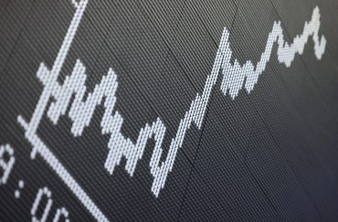 A display showing the German Stock Market Index DAX is pictured at the stock exchange in Frankfurt, western Germany,