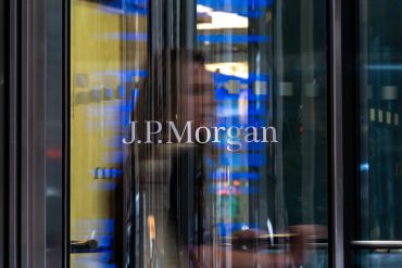 JPMorgan headquarters building in New York City with corporate logo on facade.