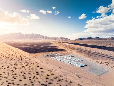 Rows of Tesla Megapack energy storage systems installed at a utility site, representing the company’s growing energy infrastructure business.
