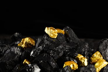 Stacked gold bars representing safe-haven demand amid global geopolitical uncertainty