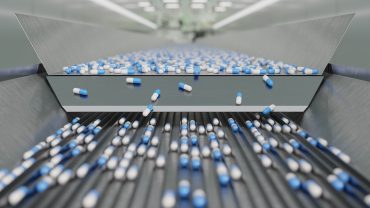 Pills and capsules close-up — Branded medicines facing soaring import costs under U.S. tariff policy.