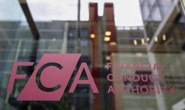 A sign on the window of the Financial Conduct Authority (FCA) headquarters